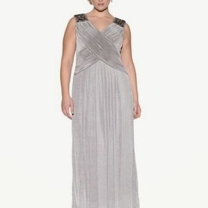 Silver formal maxi sleeveless gown with beading detail. Never worn; with tags.
